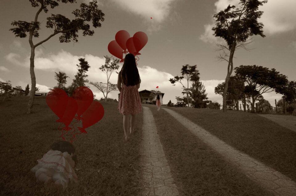 photograph of a girl with balloons depicting the life transition