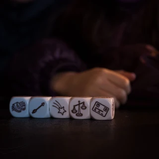 Talking to yourself depicted by a dice game with a kid's hand